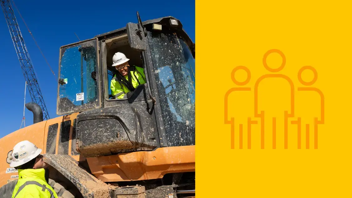 Two employees having a conversation on site