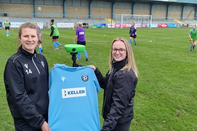 Rugby Town players Chloe Debaes and Grace Keenan with the VEO2 Sports Camera