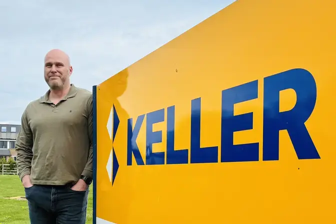 Andrew next to Keller sign