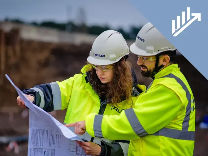 Employees looking at a plan on site