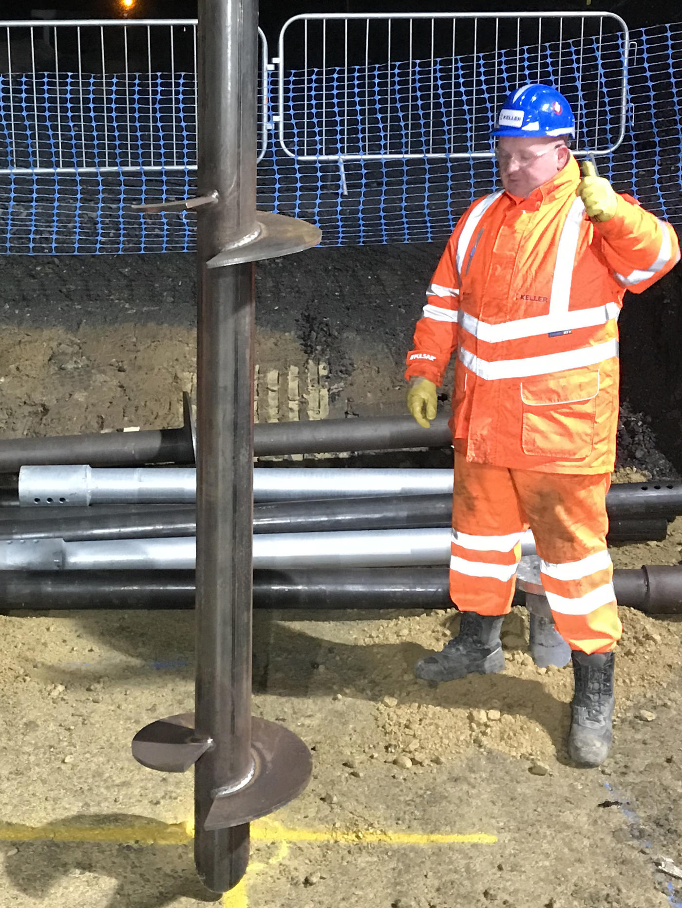 Helical piles being installed