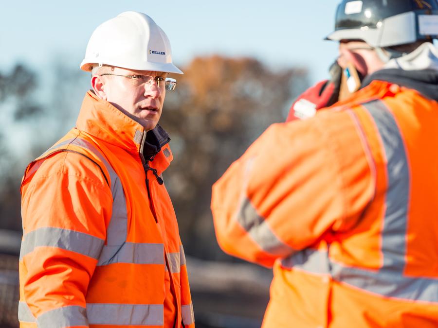 Two employees working on site