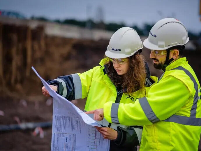 Employees looking at a plan on site