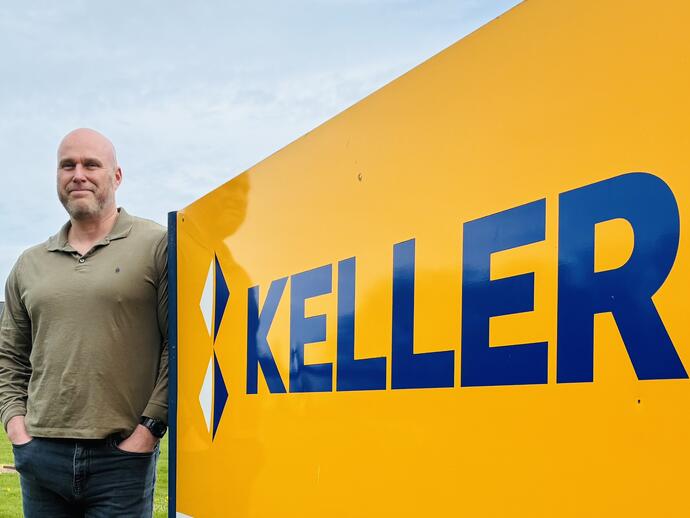 Andrew next to Keller sign