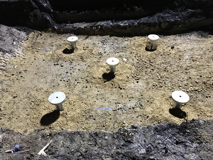 The heads of the helical piles