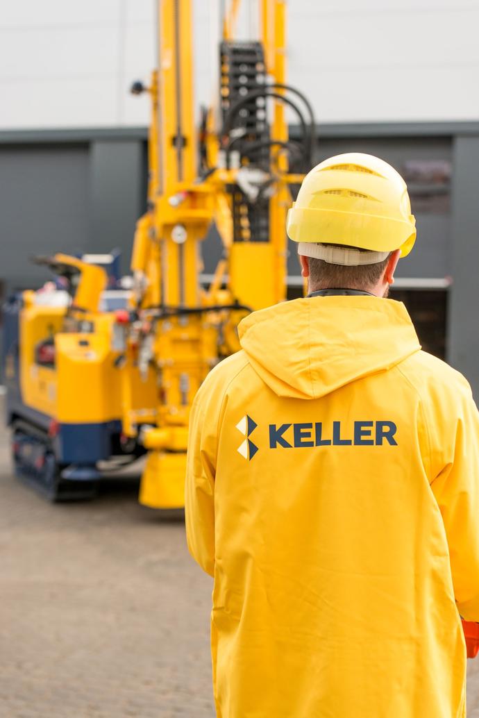man in yellow jacket with keller logo on the back